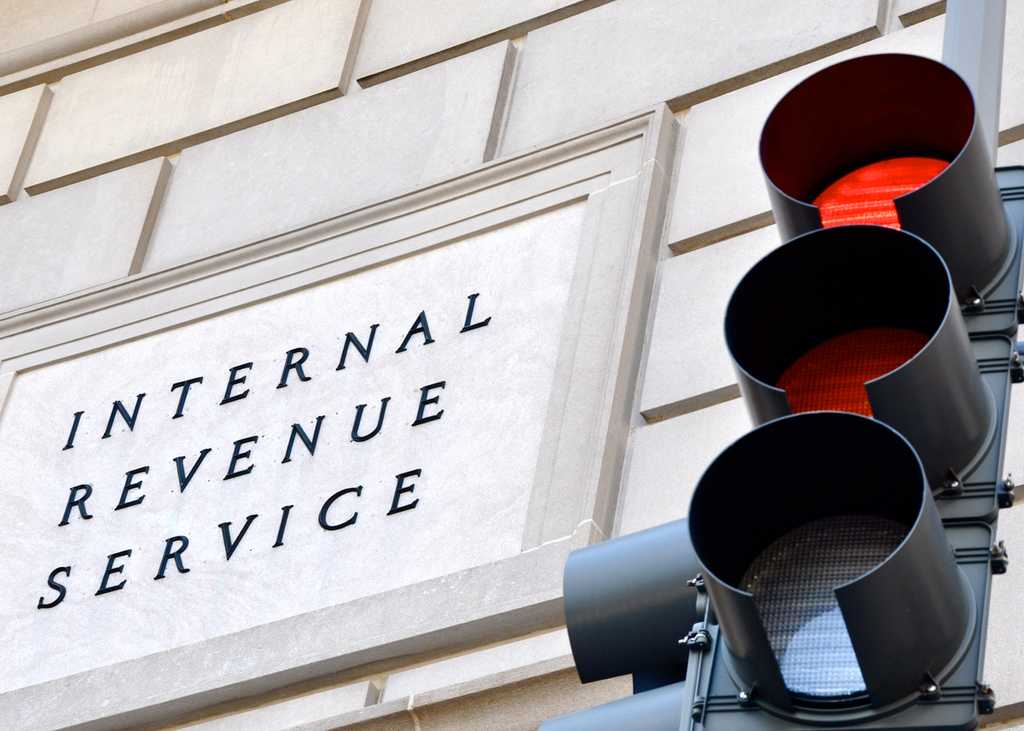 Internal Revenue Service sign with red stoplight