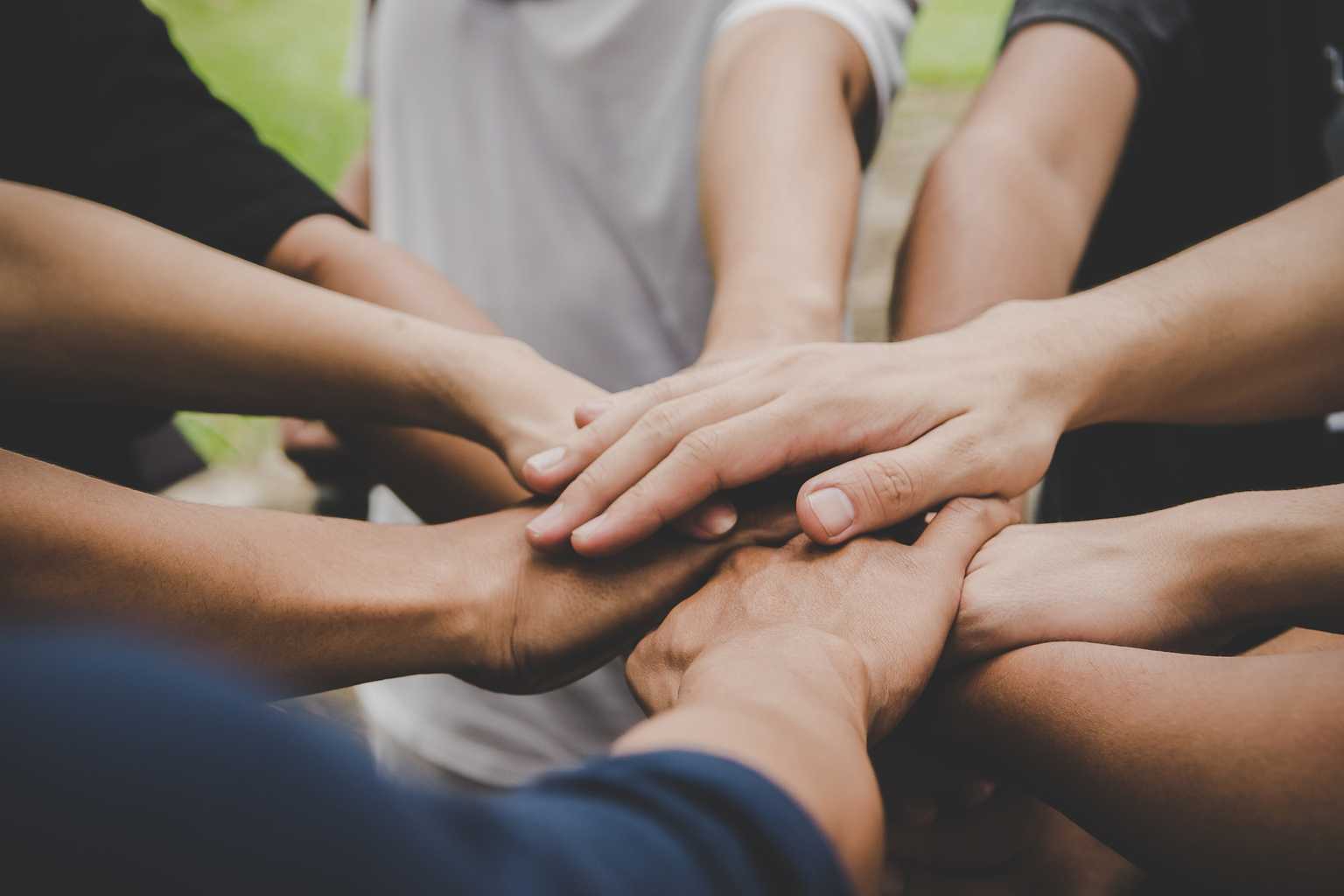 Hands stacked on each other for all hands in teamwork 