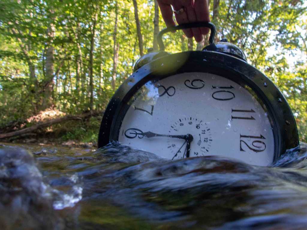 clock floating down a creek