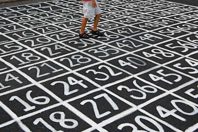 person walking on a grid of numbers