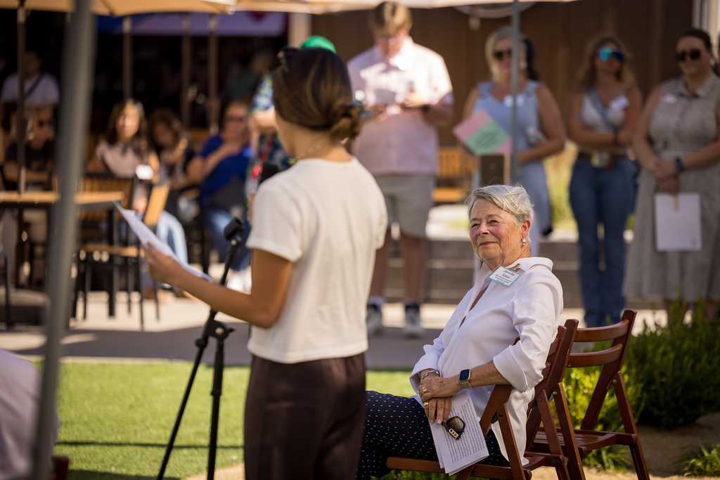 student speaking next to her donor